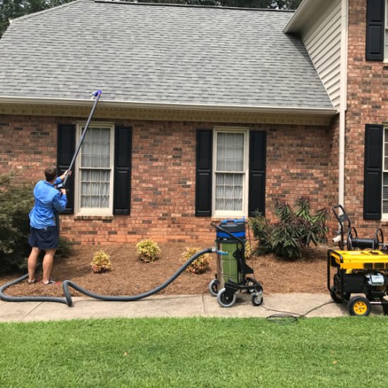 cleaning gutters front house ptc ga 550x550 1